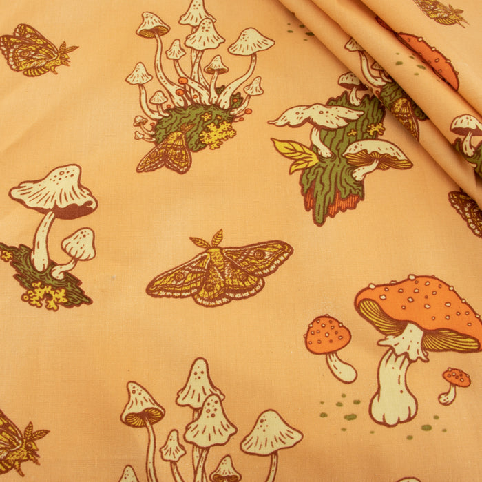Mushrooms Peachy organic fabric from Birch Fabrics. Sold by Canadian online fabric store Woven Fabric Gallery.